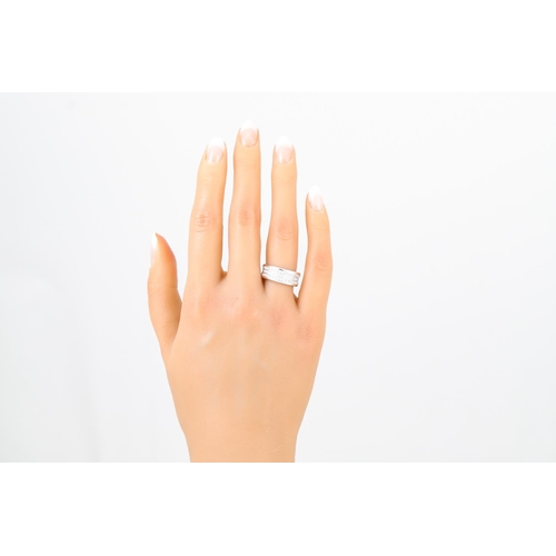 449 - A THREE ROWED DIAMOND RING, the brilliant cut diamonds mounted in 18ct white gold. Estimated: weight... 