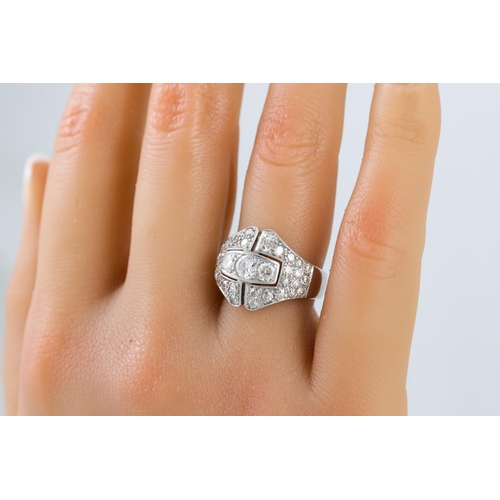 452 - A DIAMOND SET PLAQUE RING, of openwork form, the circular diamonds mounted in white gold. Estimated:... 