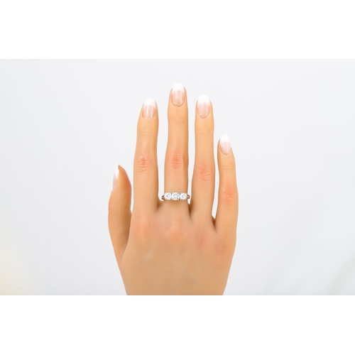 477 - A THREE STONE DIAMOND RING, mounted in 18ct gold. Size N