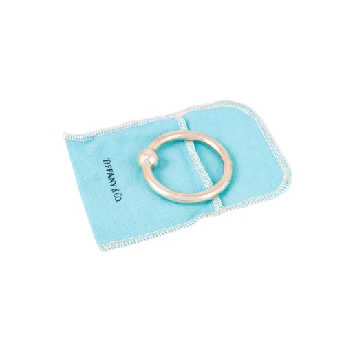 512 - A MODERN STERLING SILVER (.925) TIFFANY & CO. CIRCULAR BABY'S RATTLE, with pouch and box