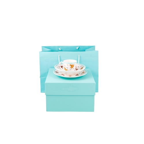 513 - A BOXED MODERN CERAMIC TIFFANY & CO. THREE PIECE CHRISTENING SET, comprising of alphabet bear patter... 