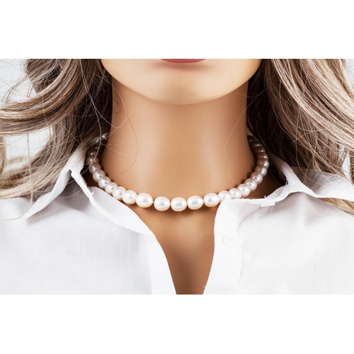 52 - A BAROQUE PEARL NECKLACE, to an 18ct gold diamond set ball clasp. Estimated; weight of diamonds: 1.0... 