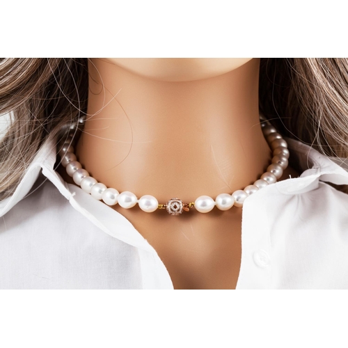 52 - A BAROQUE PEARL NECKLACE, to an 18ct gold diamond set ball clasp. Estimated; weight of diamonds: 1.0... 