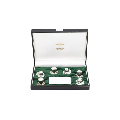 536 - A CASED SET OF EIGHT SILVER PLATED NAPKIN RINGS, together with a cased set of six silver plated menu... 