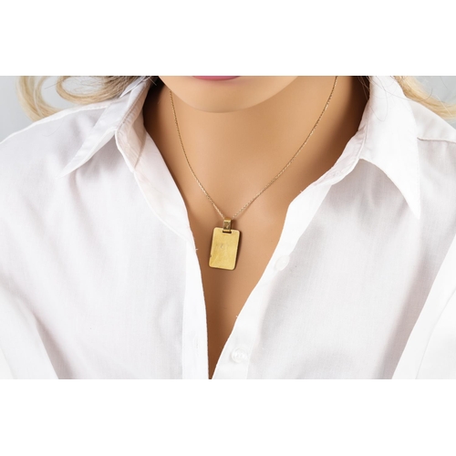 90 - AN 18CT GOLD RECTANGULAR PENDANT, on a gold chain, 7 g.