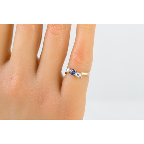 97 - AN ANTIQUE DIAMOND AND SAPPHIRE RING, twist design mounted in 9ct yellow gold