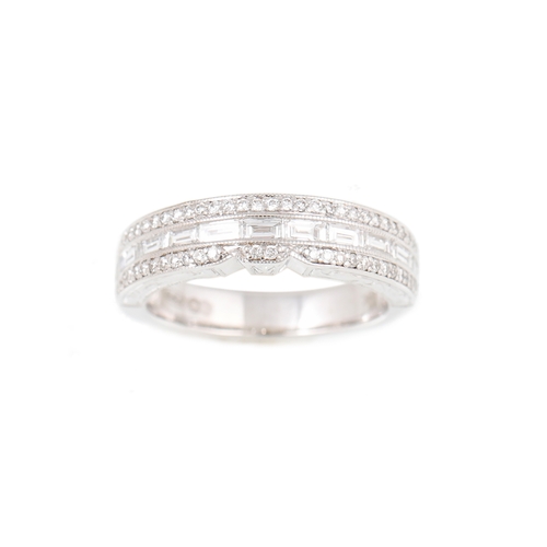 422 - A DIAMOND SET BAND RING, set with baguette and round brilliant cut stones mounted in 18ct white gold... 