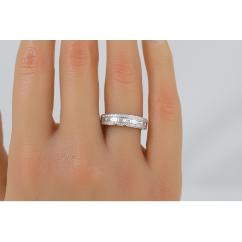 422 - A DIAMOND SET BAND RING, set with baguette and round brilliant cut stones mounted in 18ct white gold... 