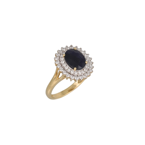 101 - A DIAMOND AND SAPPHIRE CLUSTER RING, the oval sapphire to round brilliant cut diamond surround, moun... 