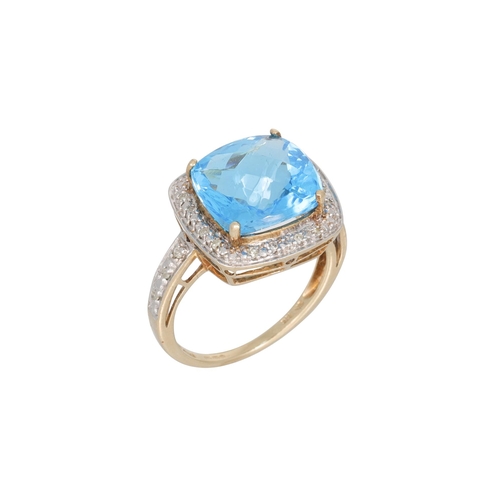 103 - A DIAMOND AND TOPAZ DRESS RING, the mixed cut topaz to diamond surround and shoulders, mounted in ye... 