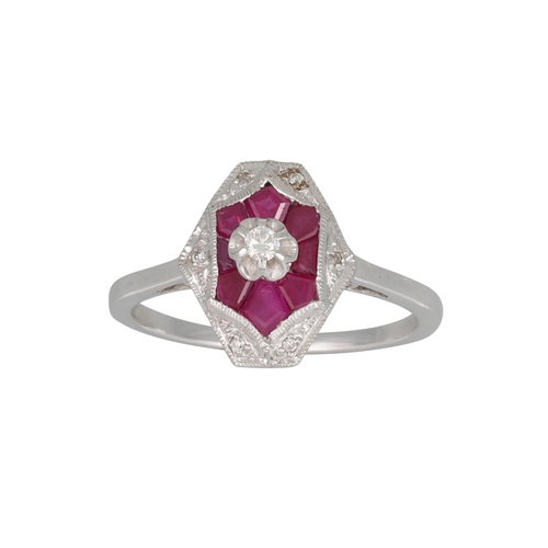 113 - A DIAMOND AND RUBY CLUSTER RING, the hexagonal shaped ring with raised central diamond, mounted in 9... 