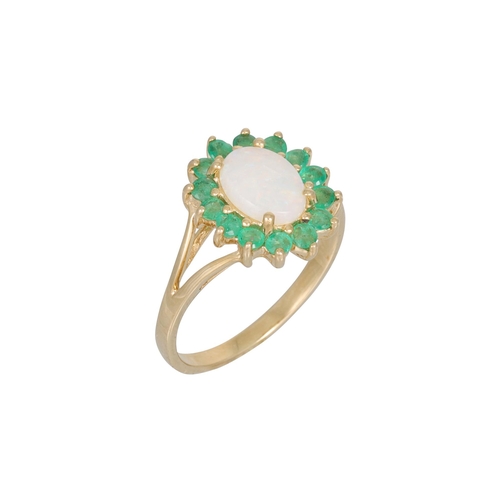 114 - AN OPAL AND EMERALD CLUSTER RING, the oval opal to emerald surround, mounted in 9ct yellow gold, siz... 