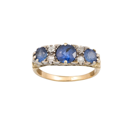 115 - A VINTAGE SAPPHIRE AND DIAMOND RING, the circular sapphires set between diamond points, to a carved ... 