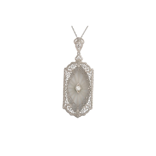 139 - A ROCK CRYSTAL AND DIAMOND PENDANT, the rectangular pendant with canted corners, in 14ct & platinum,... 