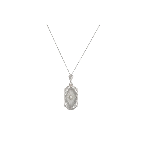 139 - A ROCK CRYSTAL AND DIAMOND PENDANT, the rectangular pendant with canted corners, in 14ct & platinum,... 