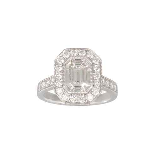 157 - A DIAMOND CLUSTER RING, the baguette and brilliant cut diamonds, to diamond shoulders, mounted in 18... 