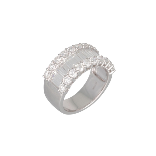 158 - A DIAMOND SET THREE ROWED RING, the baguette and brilliant cut diamonds mounted in 18ct white gold. ... 