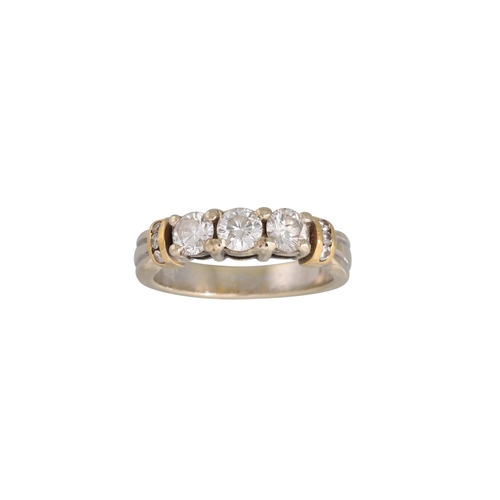 18 - A THREE STONE DIAMOND RING, the brilliant cut diamonds mounted in 18ct gold. Estimated: weight of di... 