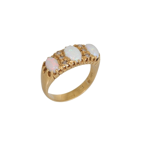 185 - A VICTORIAN THREE STONE OPAL AND DIAMOND RING, mounted in 18ct. Size: S