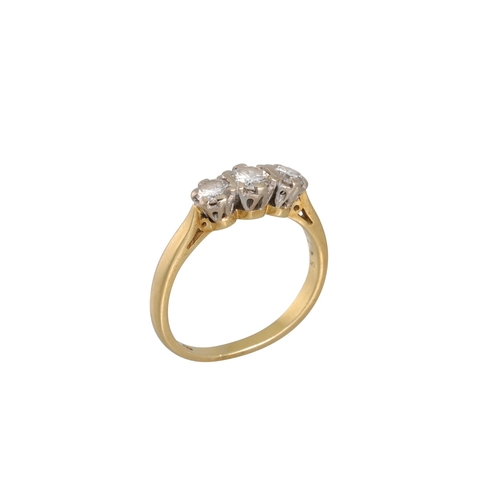 19 - A THREE STONE DIAMOND RING, the brilliant cut diamonds mounted in 18ct gold. Estimated: weight of di... 