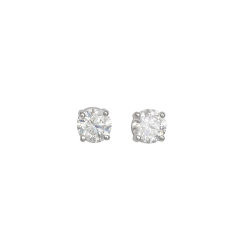 192 - A PAIR OF DIAMOND STUD EARRINGS, the round brilliant cut diamond mounted in 18ct white gold. Estimat... 