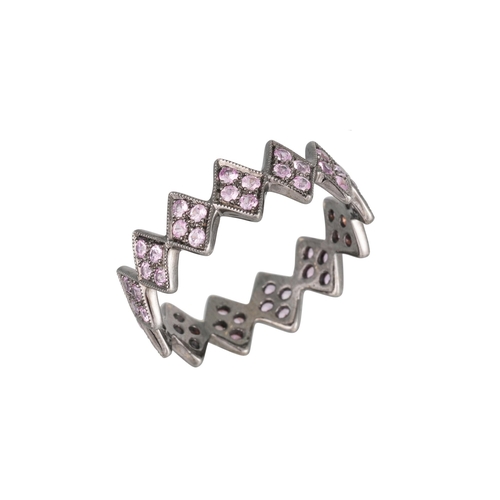 213 - A RUBY SHAPED BAND RING, in zig-zag form, mounted in 18ct white gold, black rhodium plated. Estimate... 