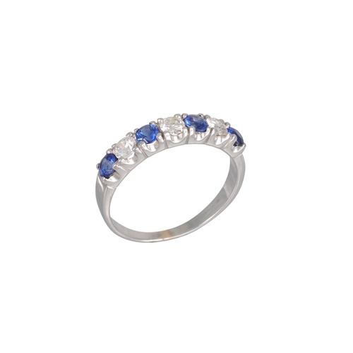 219 - A DIAMOND AND SAPPHIRE RING, mounted in 18ct white gold, size P