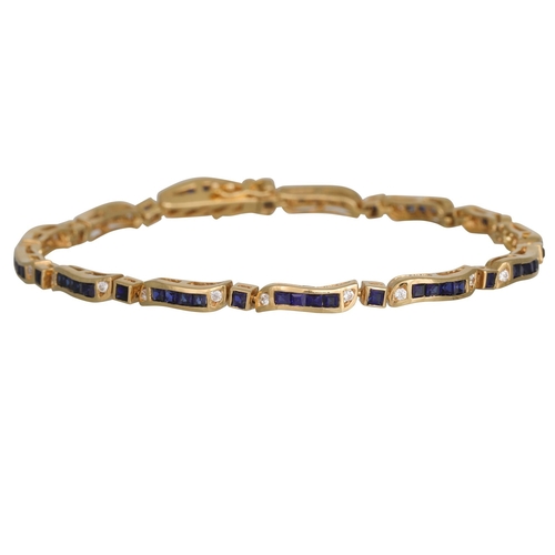 248 - A STONE SET LINE BRACELET, channel set in 18ct yellow gold