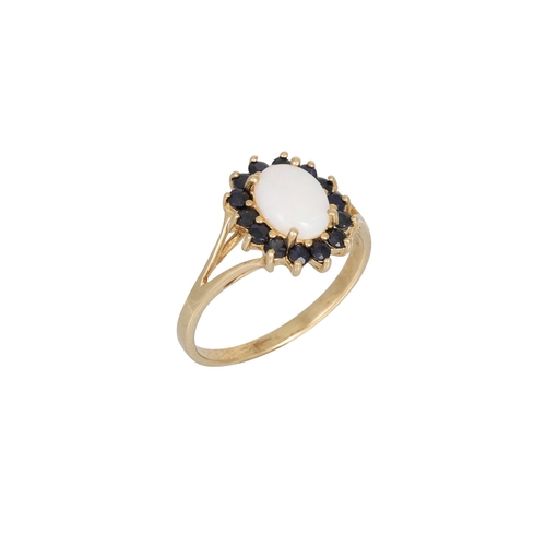 25 - AN OPAL AND SAPPHIRE CLUSTER RING, the oval-shaped opal to sapphire surround, mounted in yellow gold... 