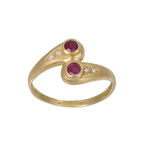 252 - A RUBY AND DIAMOND RING, of twist design mounted in 18ct yellow gold, Size M