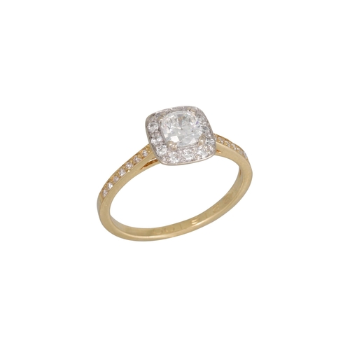 256 - A DIAMOND HALO CLUSTER RING, mounted in 18ct yellow gold. Estimated: weight of centre diamond: 0.62 ... 