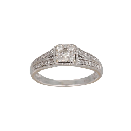 259 - A DIAMOND CLUSTER RING, the brilliant cut diamonds mounted in 18ct white gold. Estimated: weight of ... 