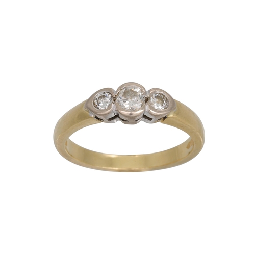 267 - A THREE STONE DIAMOND RING, the collet diamonds mounted in 18ct white and yellow gold. Estimated: we... 