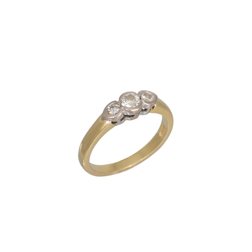 267 - A THREE STONE DIAMOND RING, the collet diamonds mounted in 18ct white and yellow gold. Estimated: we... 