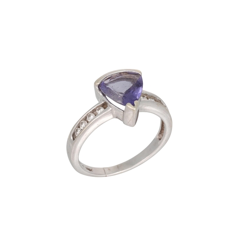 27 - A TANZANITE AND DIAMOND RING, the trillion cut tanzanite to diamond shoulders, mounted in white gold... 