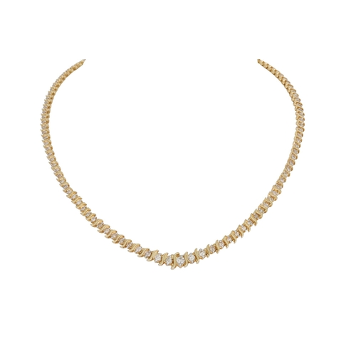 270 - A DIAMOND LINE NECKLACE, the graduated brilliant cut diamonds set between wavy knife edge bars, moun... 