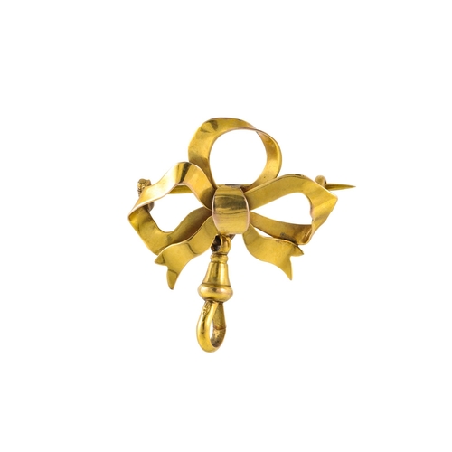 299 - A 9CT GOLD VINTAGE BROOCH, modelled as a bow, with pendant attachment, 3.6 g. together with an antiq... 