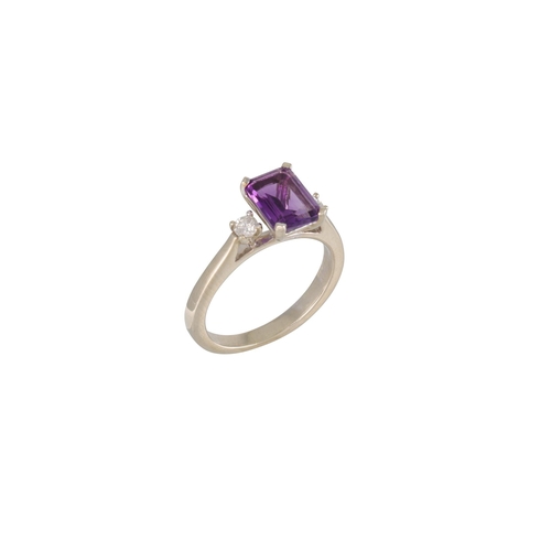 3 - AN AMETHYST AND DIAMOND THREE STONE DRESS RING, the emerald cut amethyst flanked by two round brilli... 