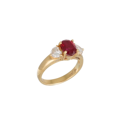 303 - A RUBY AND DIAMOND THREE STONE RING, the oval ruby to heart shaped diamond shoulders, mounted in 18c... 