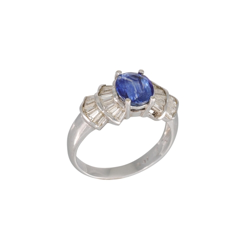 304 - A SAPPHIRE AND DIAMOND RING, the oval sapphire to tapered baguette shoulders, mounted in white gold.... 