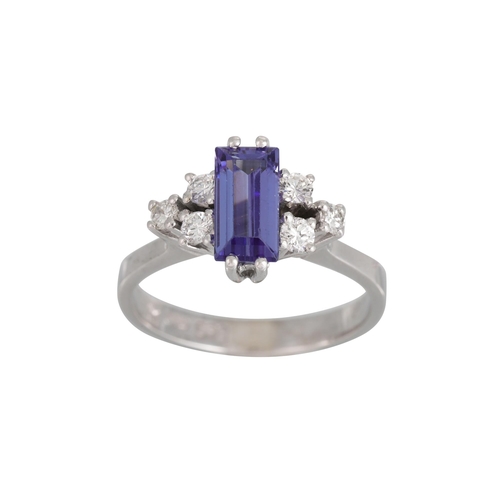 319 - A TANZANITE AND DIAMOND RING, the rectangular tanzanite to diamond shoulders, in 14ct white gold. Es... 