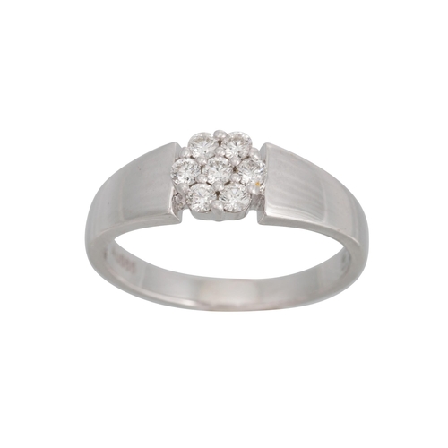 329 - A DIAMOND CLUSTER RING, the brilliant cut diamonds mounted in 14ct white gold. Estimated: weight of ... 