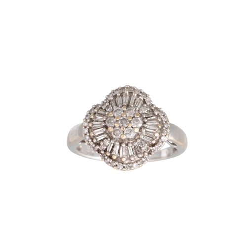 337 - A DIAMOND CLUSTER DRESS RING, set with round brilliant cut and tapered baguette cut diamonds, mounte... 