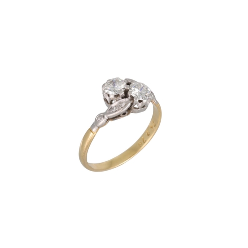 339 - A VINTAGE TWO STONE DIAMOND RING, of cross over design to diamond shoulders, mounted in 18ct yellow ... 