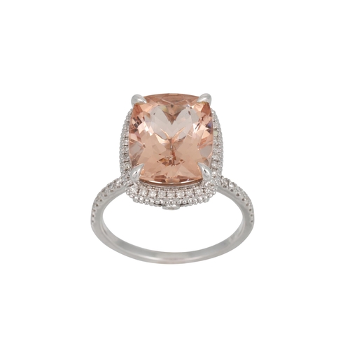 34 - A MORGANITE AND DIAMOND CLUSTER RING, the radiant cut morgainte to diamond shoulders, mounted in 14c... 