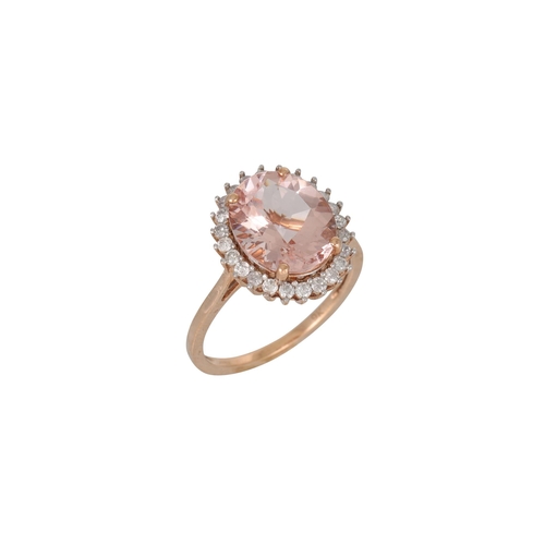 350 - A MORGANITE AND DIAMOND CLUSTER RING, the oval morganite to a brilliant cut diamond surround, mounte... 