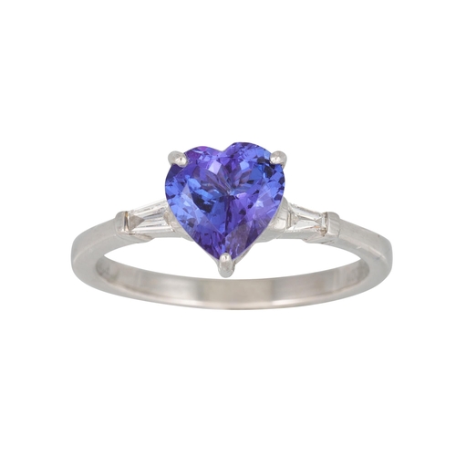 355 - A TANZANITE RING, heart shaped stone to a tapered baguette diamond shoulders, mounted in platinum, s... 