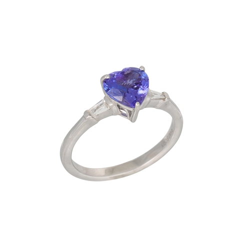 355 - A TANZANITE RING, heart shaped stone to a tapered baguette diamond shoulders, mounted in platinum, s... 