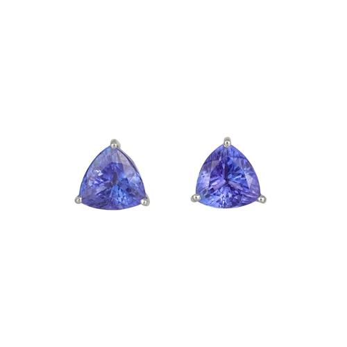 358 - A PAIR OF TANZANITE EARRINGS, the trillion shaped stones mounted in platinum, screw fittings