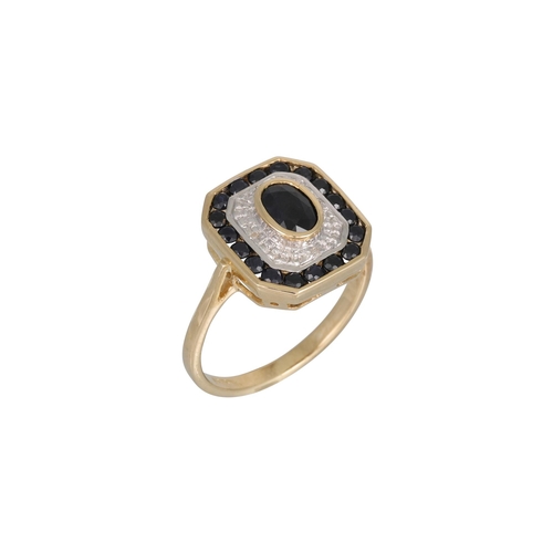 36 - A DIAMOND AND SAPPHIRE CLUSTER RING, octagonal plaque form, mounted in 9ct yellow gold, size L – M